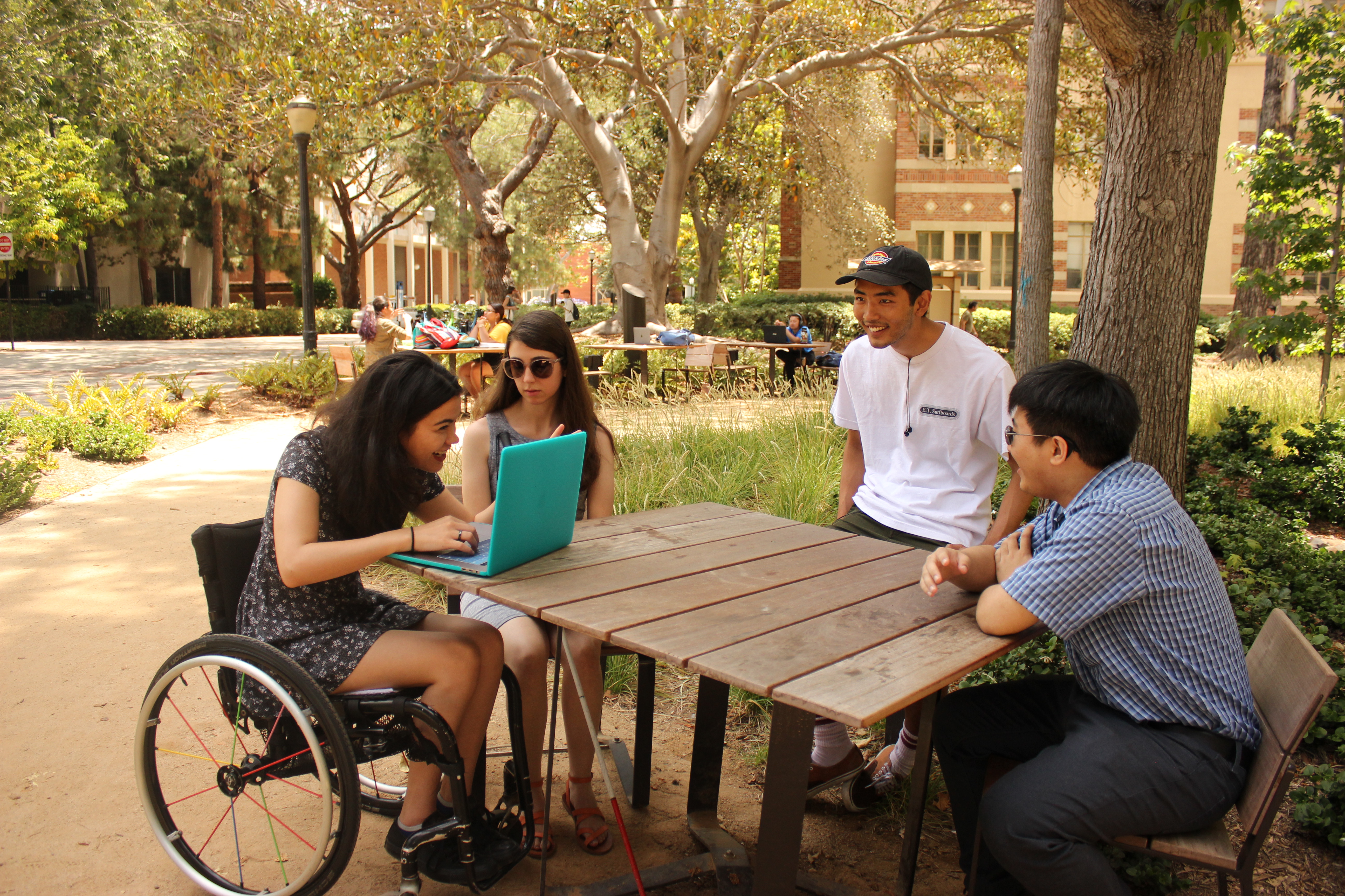 Four members of the DCP team talking at a table